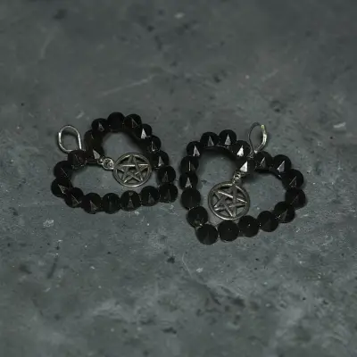 Aretes pedrería corazón pentagrama